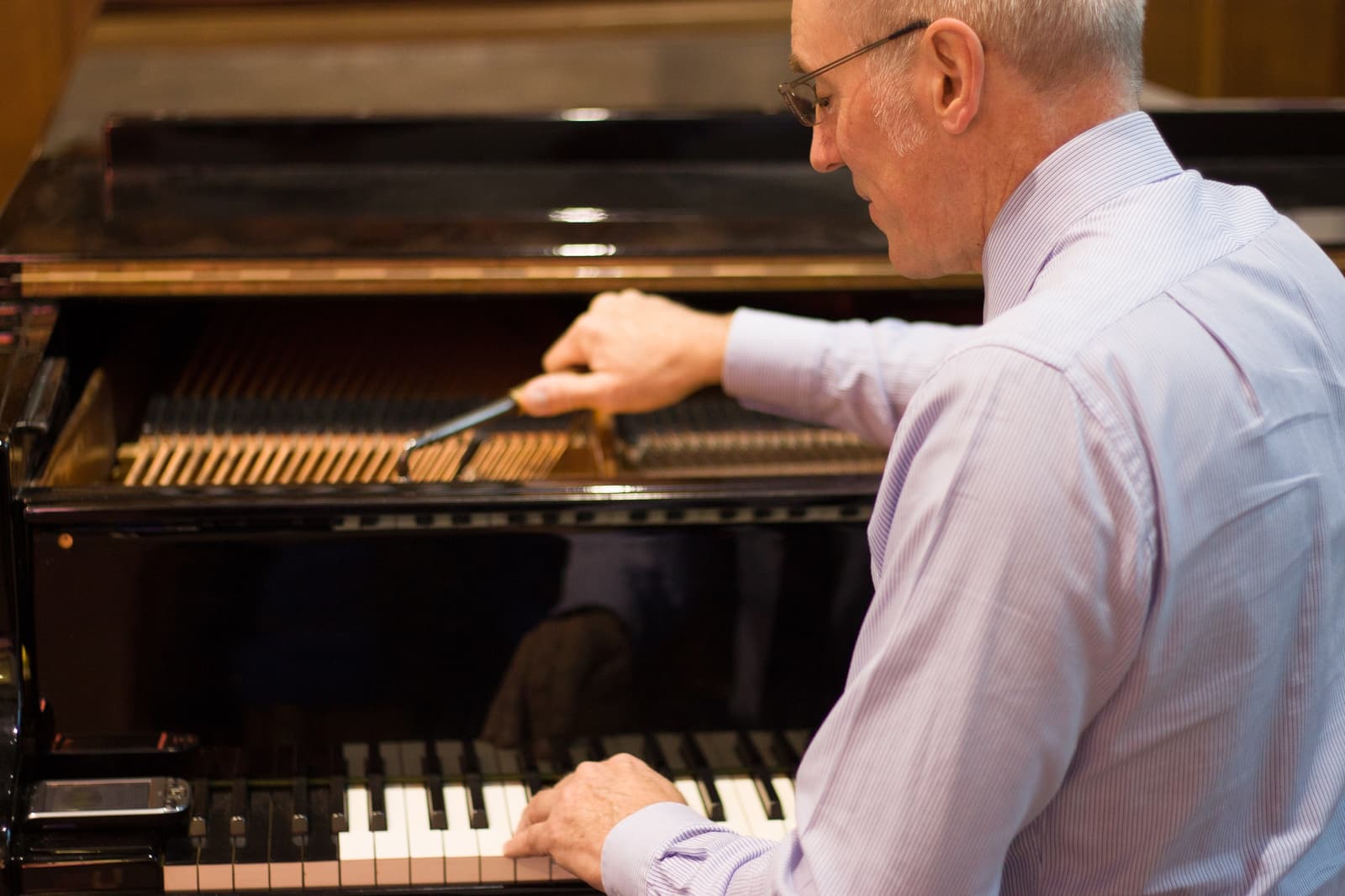 Paul Fox tuning a piano